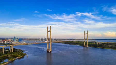 Majestic urban infrastructure crosses Florida's coastal waters. The dramatic sky adds depth and...