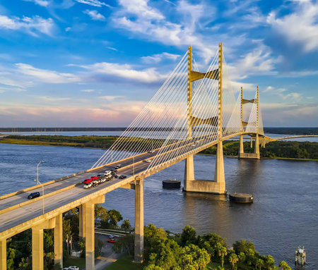 Cable-stayed bridge spans the St. Johns River in Jacksonville, Florida. Evening sunlight enhances the modern structure.の写真素材