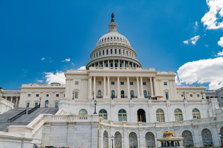 historic architecture of the Capitol against a bright sky.