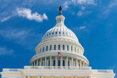 United States Capitol Dome Under Clear Blue Skyの写真素材
