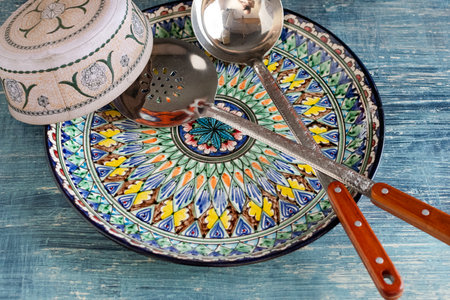 Closeup of artisan ceramic tableware and wooden-handle ladles.