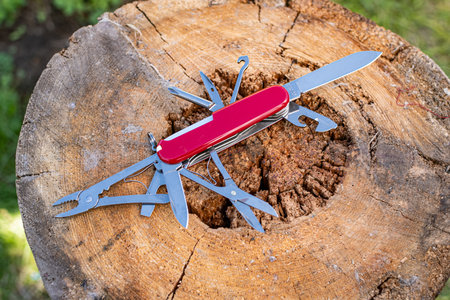 Classic Swiss army knife fully extended to reveal pliers, scissors, blade, and bottle opener