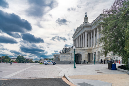 Capitol Police SUV beside the historic marble building. Government architecture and policing meet in this urban scene.の写真素材