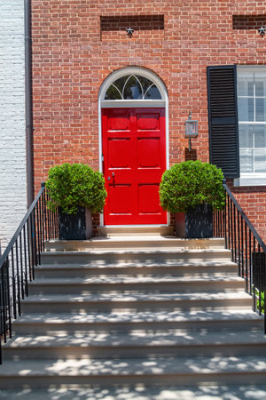 Red Door Entrance of Historic Townhouse in Washington DC During Autumn