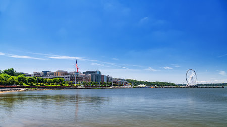 Ferris wheel and waterfront skyline at National Harbor near Washington DCの写真素材