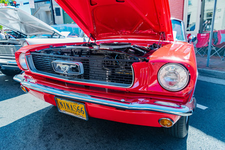 Red 1966 Ford Mustang with open hood at car show in Virginiaのeditorial素材