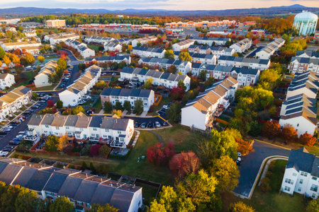 Colorful autumn neighborhood in Leesburg with rows of houses at sunriseの写真素材