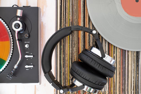 Retro hi-fi setup with vinyl player, gray LP, and classic headphonesの写真素材