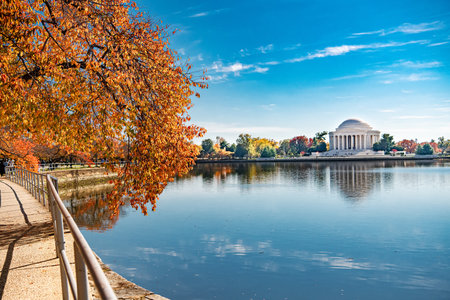 Washington DC landmark surrounded by colorful autumn trees and calm waterの写真素材