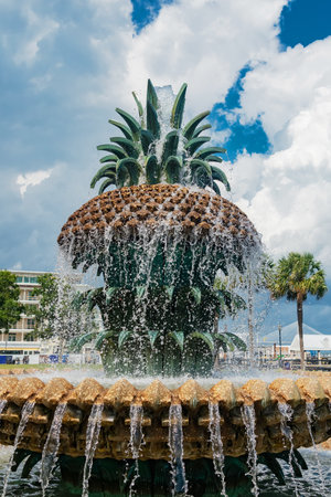Flowing water from pineapple sculpture in urban garden in Charleston