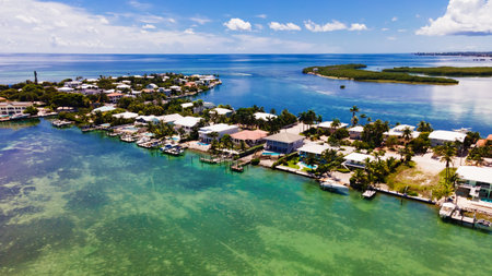 Tropical waterfront neighborhood with docks and clear ocean in Key Westの写真素材