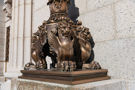 Close-up of antique bronze column base with intricate classical ornamentationの写真素材