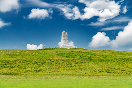 Historic Wright Brothers Memorial rising above green hill in North Carolinaの写真素材