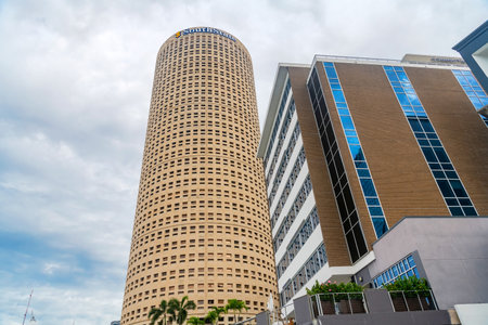 scene of city life with a tower in downtown Tampa against the sky.