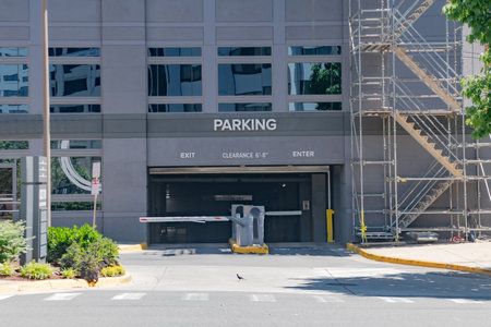 Public parking entrance garage with automated barrier in modern urban infrastructure