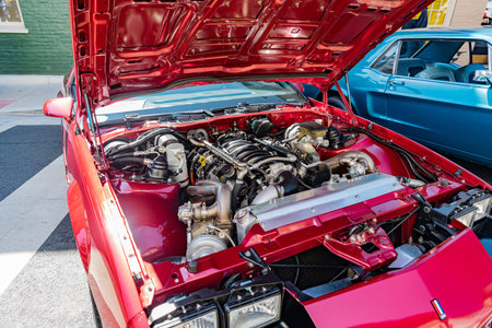 Close-up of the engine of a vintage Chevrolet Camaro Z28 during a car show