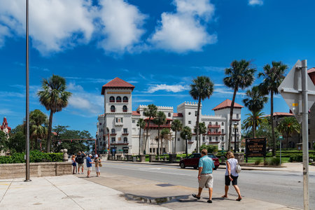 sunny city intersection with spanish architecture palm trees and cars in st. Augustineのeditorial素材