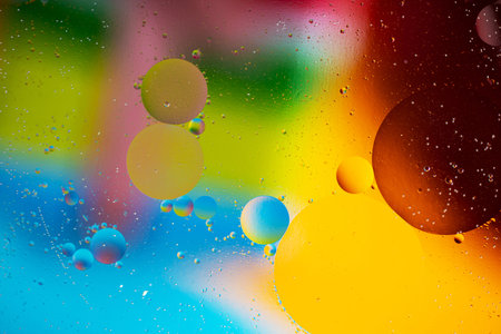 Vibrant gradient background with oil droplets macro