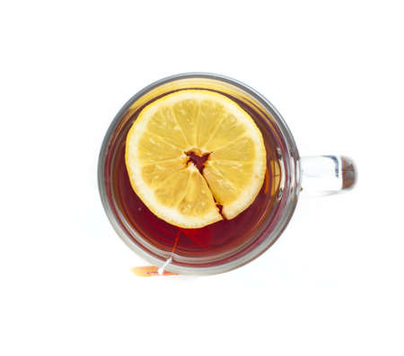 Tea with lemon in a glass cup on a white background  Tea bagの写真素材