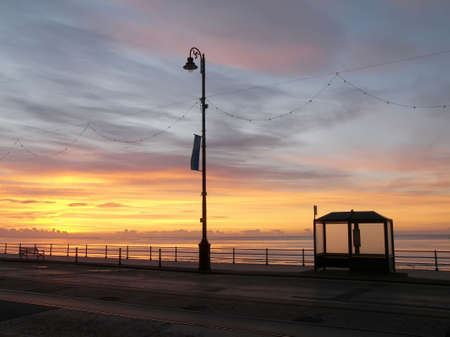 Early morning bus stop on promenadeの写真素材