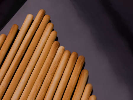 Bread stick on black. の写真素材