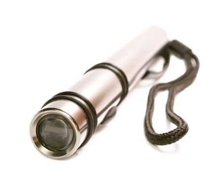 Metallic flashlight is isolated on the white isolated.の写真素材