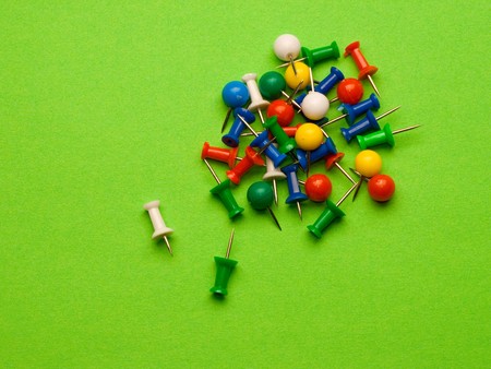 Push pins isolated on greenの写真素材