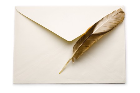 Envelope and feather isolated on whiteの写真素材