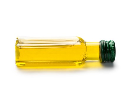 Olive oil isolated on whiteの写真素材