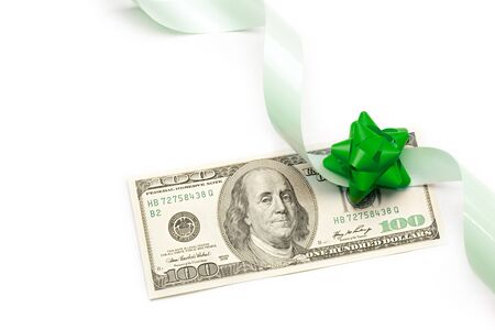 Dollar with holidays bow isolated on whiteの写真素材