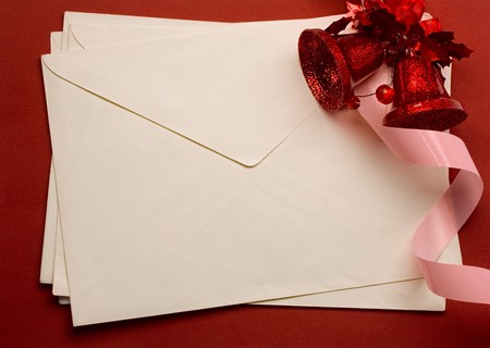 Envelope with bell isolated on red background 