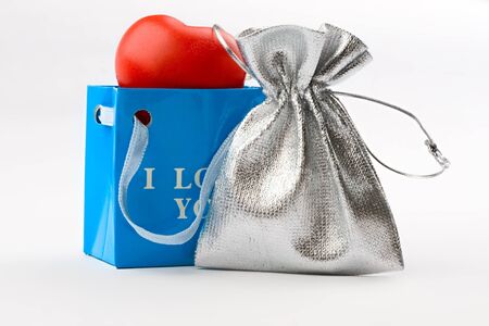 Bags and heart isolated on whiteの写真素材