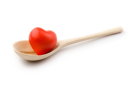 Spoon and heart isolated on whiteの写真素材