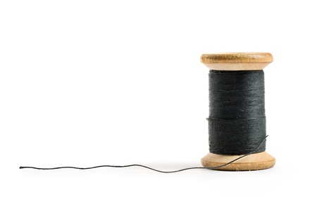 Thread bobbin isolated on white backgroundの写真素材