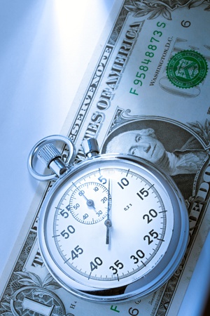 Stopwatch and dollarの写真素材