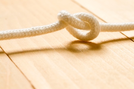 Knot on the wooden backgroundの写真素材