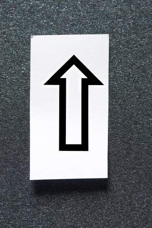 Arrow isolated on grey backgroundの写真素材