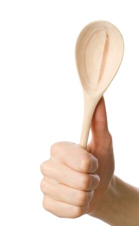 Woman holding wooden spoon in the hand の写真素材