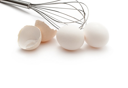 Eggs with whisk isolated on the white background