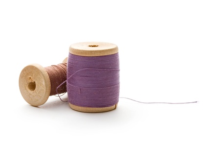 Thread bobbins on the white background 