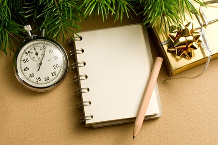 Christmas tree, stopwatch, gift and notepadの写真素材