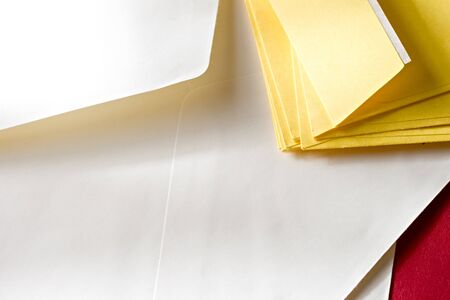 A pile of envelopes on the red background