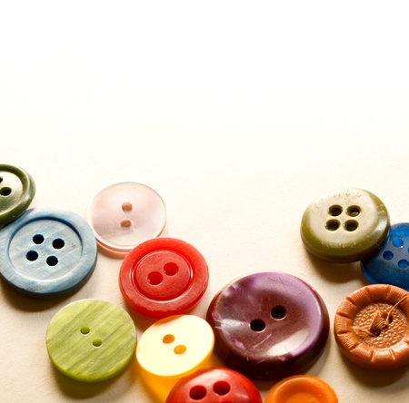 A pile of many-coloured buttonsの写真素材