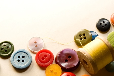 A pile of many-coloured buttonsの写真素材