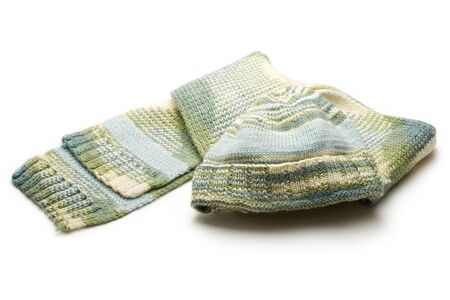 Set of a cap and a scarf on white