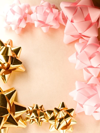 A frame of pink and golden bowsの写真素材
