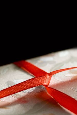 Gift box with red ribbonの写真素材