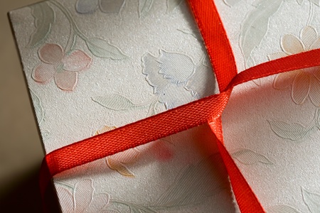 Gift box with red ribbonの写真素材