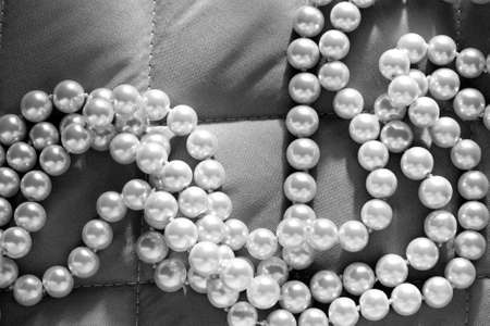 String of pearls on a gray fabricの写真素材