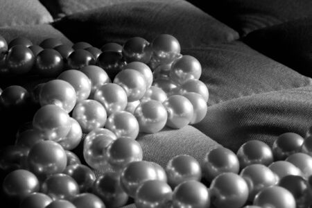 String of pearls on a gray fabricの写真素材